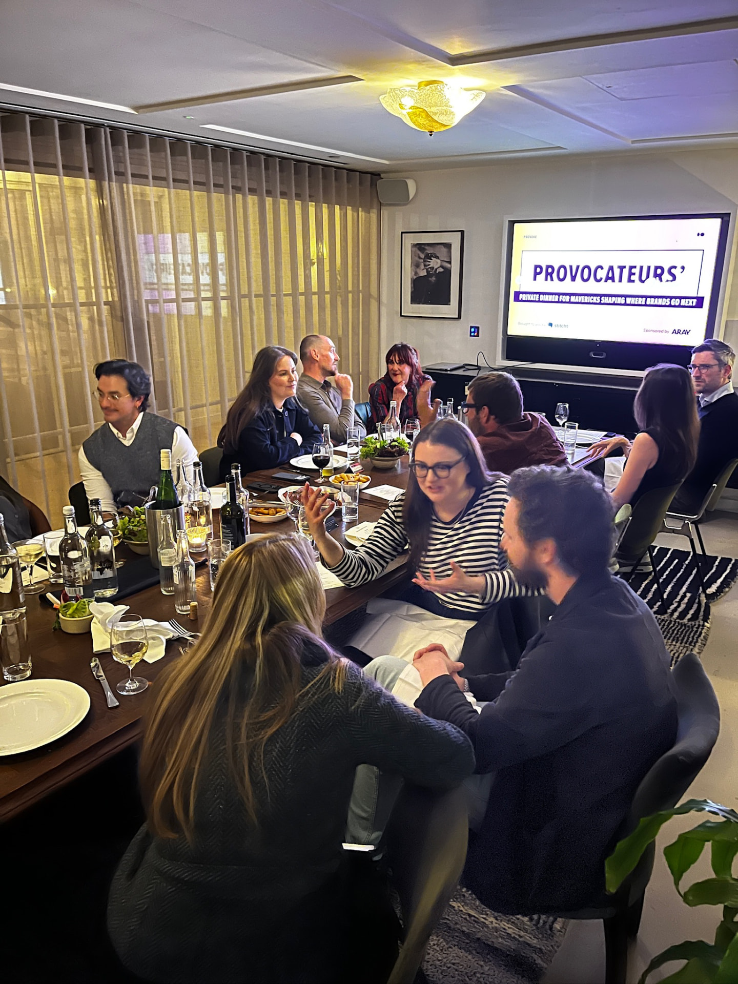Provocateurs' Dinner guests in conversation