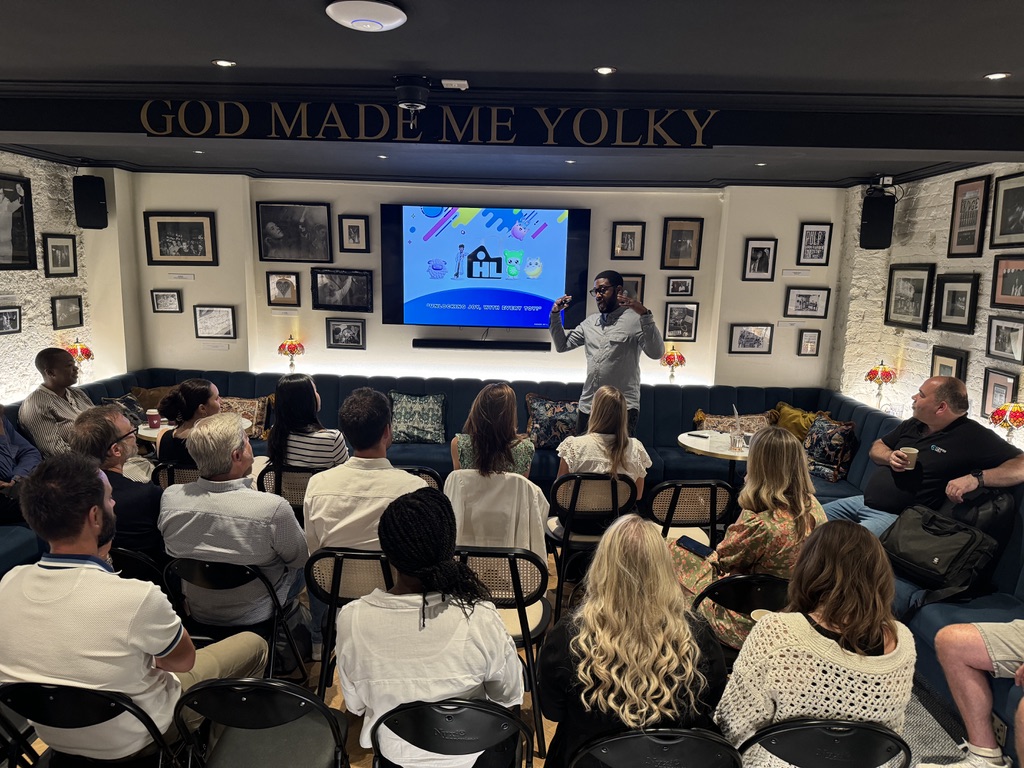 A speaker addressing guests at an intimate Provoke event